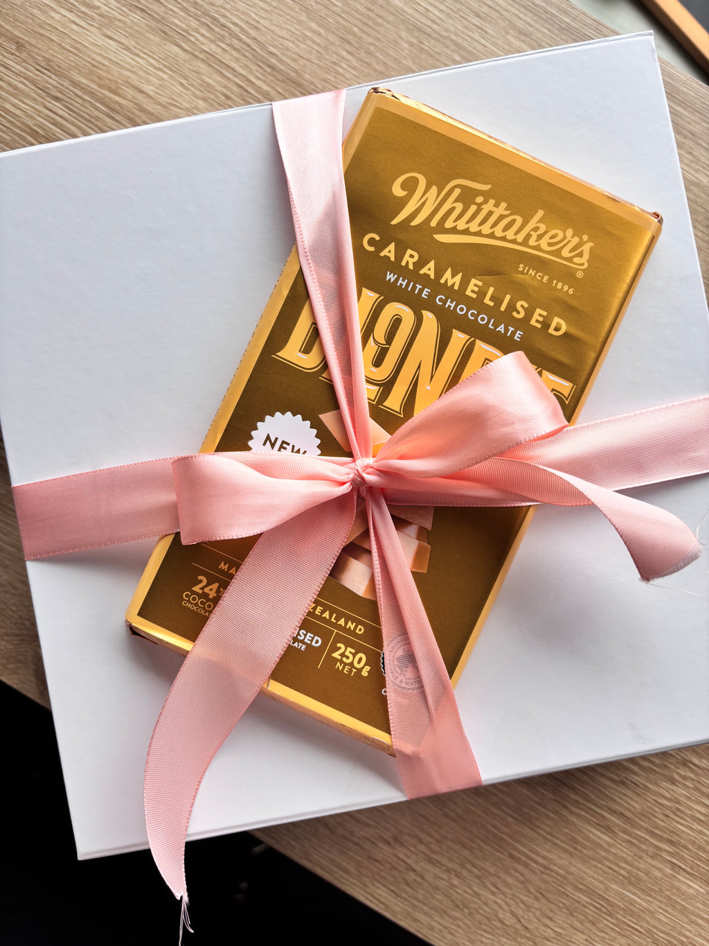 Gift wrapping and a block of whittakers chocolate
