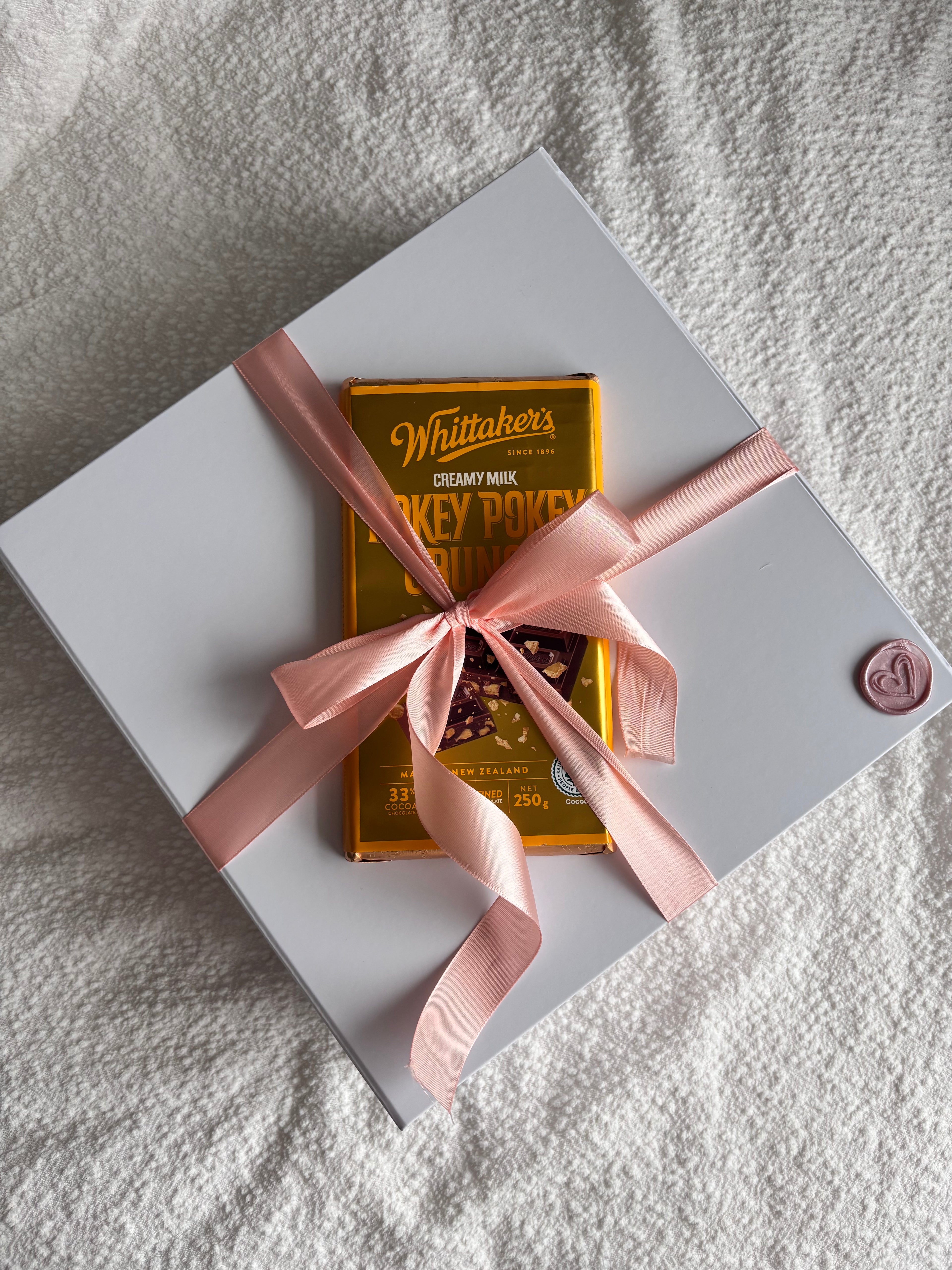Gift wrapping and a block of whittakers chocolate